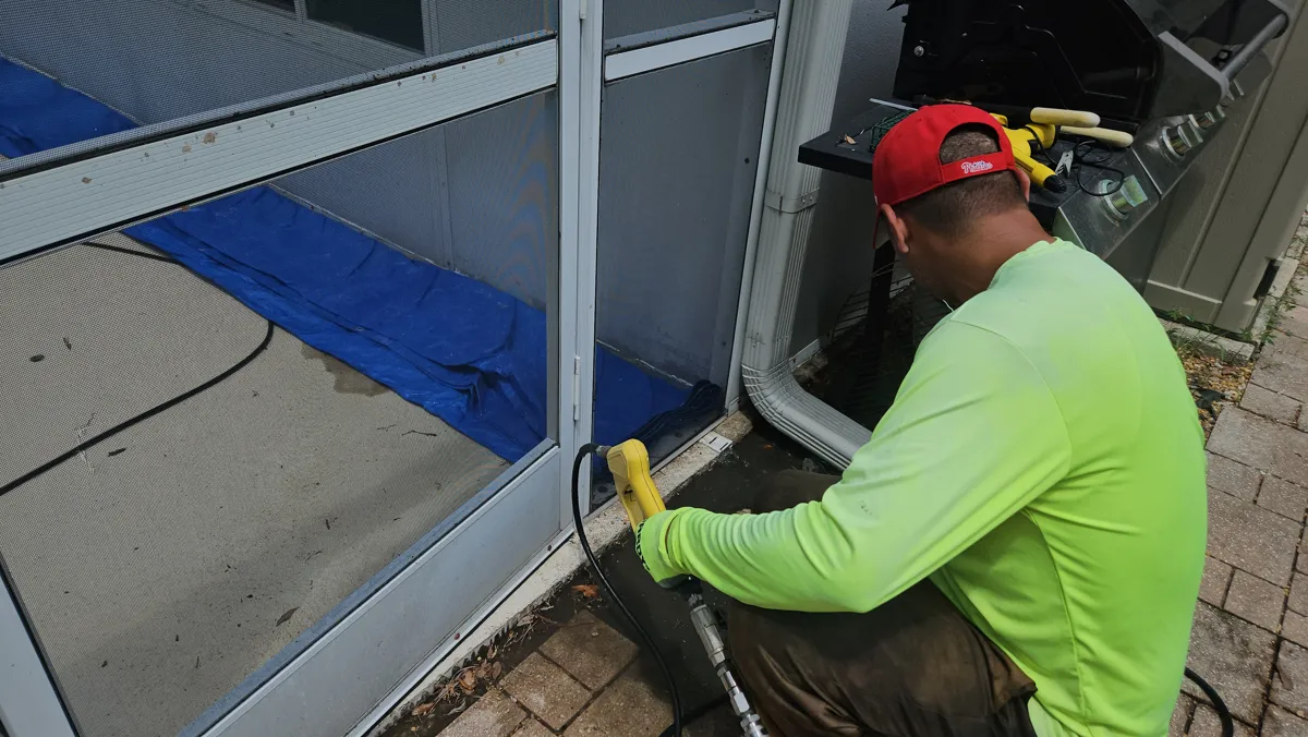 Brian Vasquez performing professional hydro-jetting on a clogged drain in Land O' Lakes, Florida