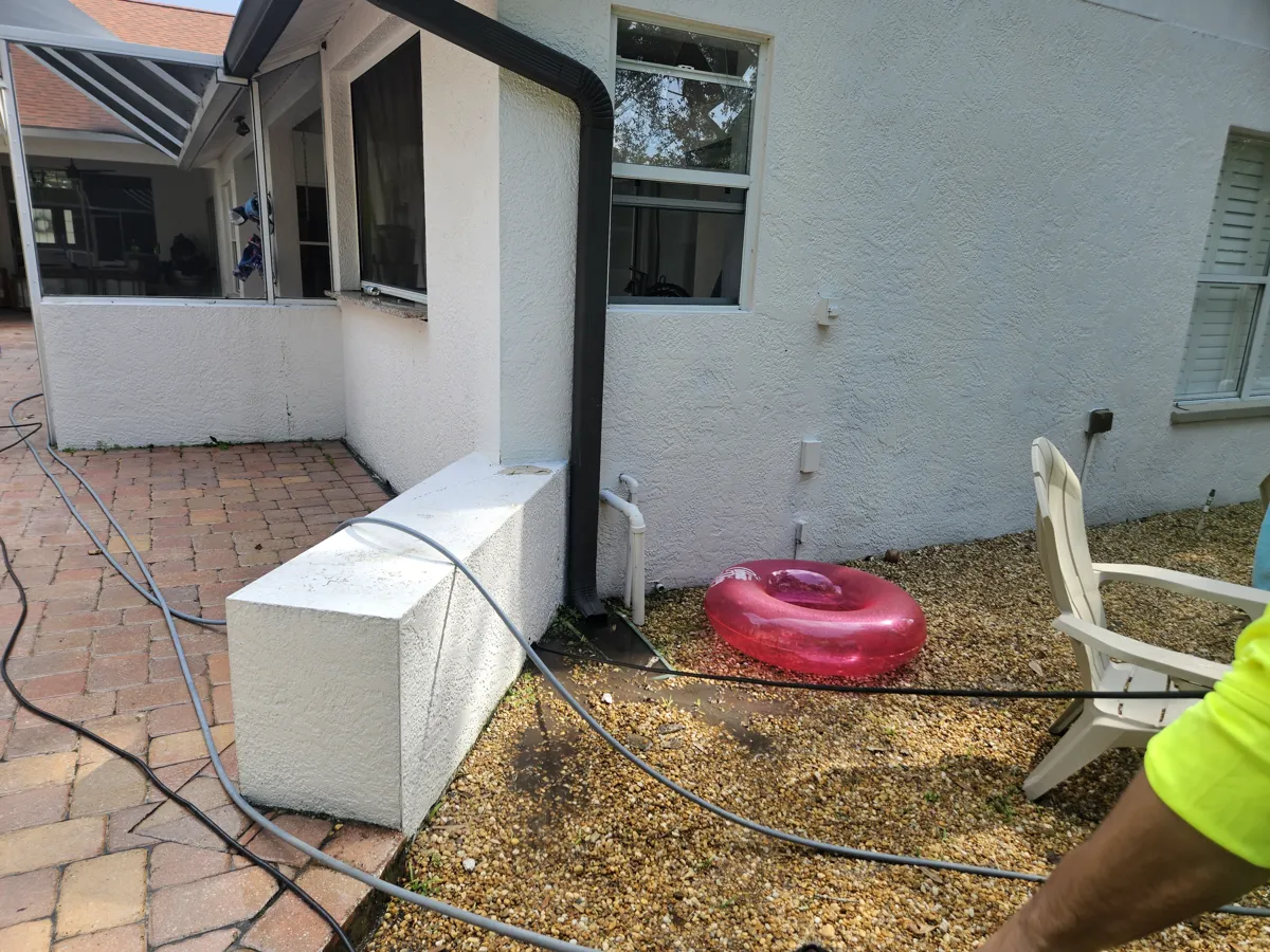Pulling the long hydro jetting line out of a fully cleared drain in Tampa Bay