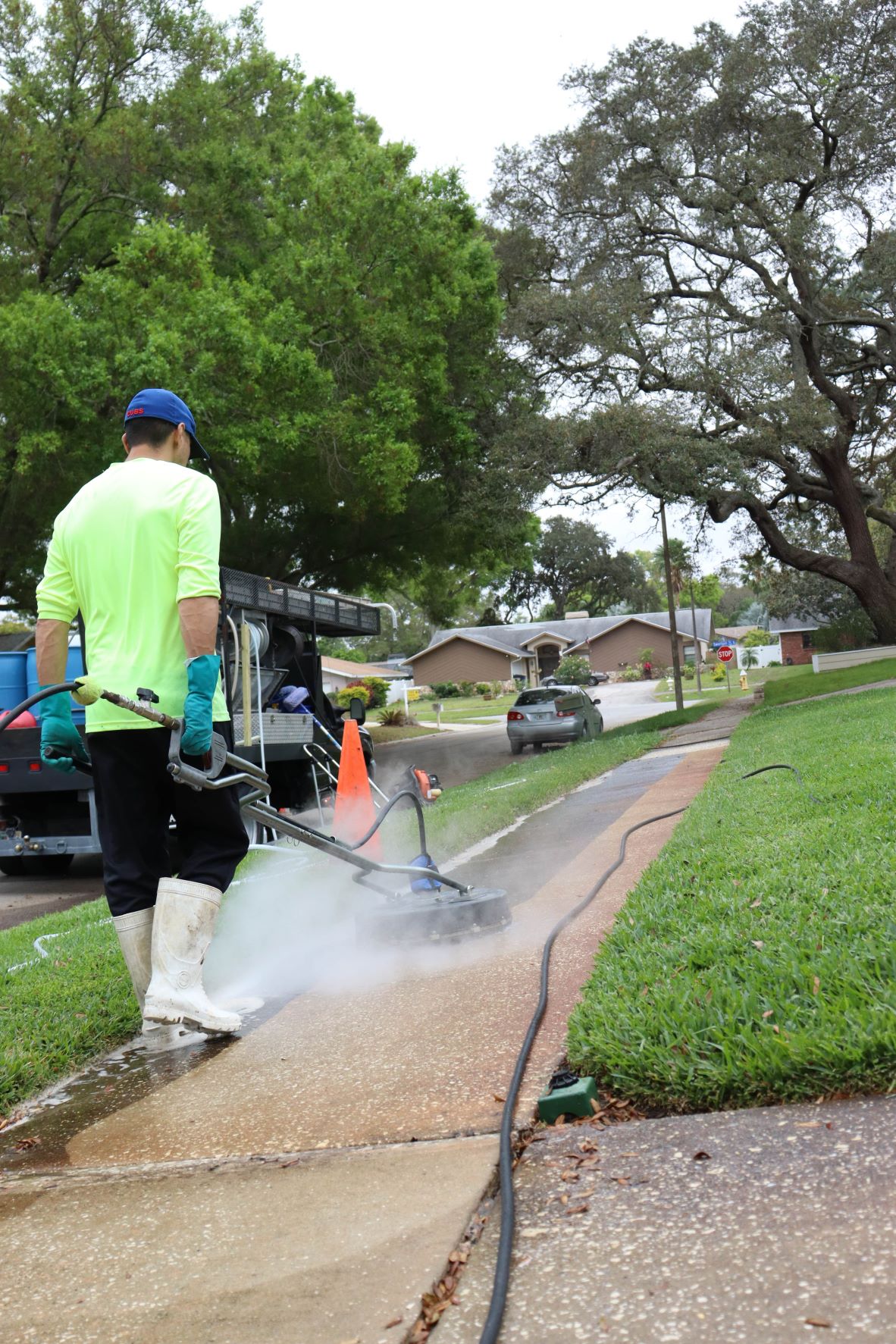 man power washing sidewalk clearwater