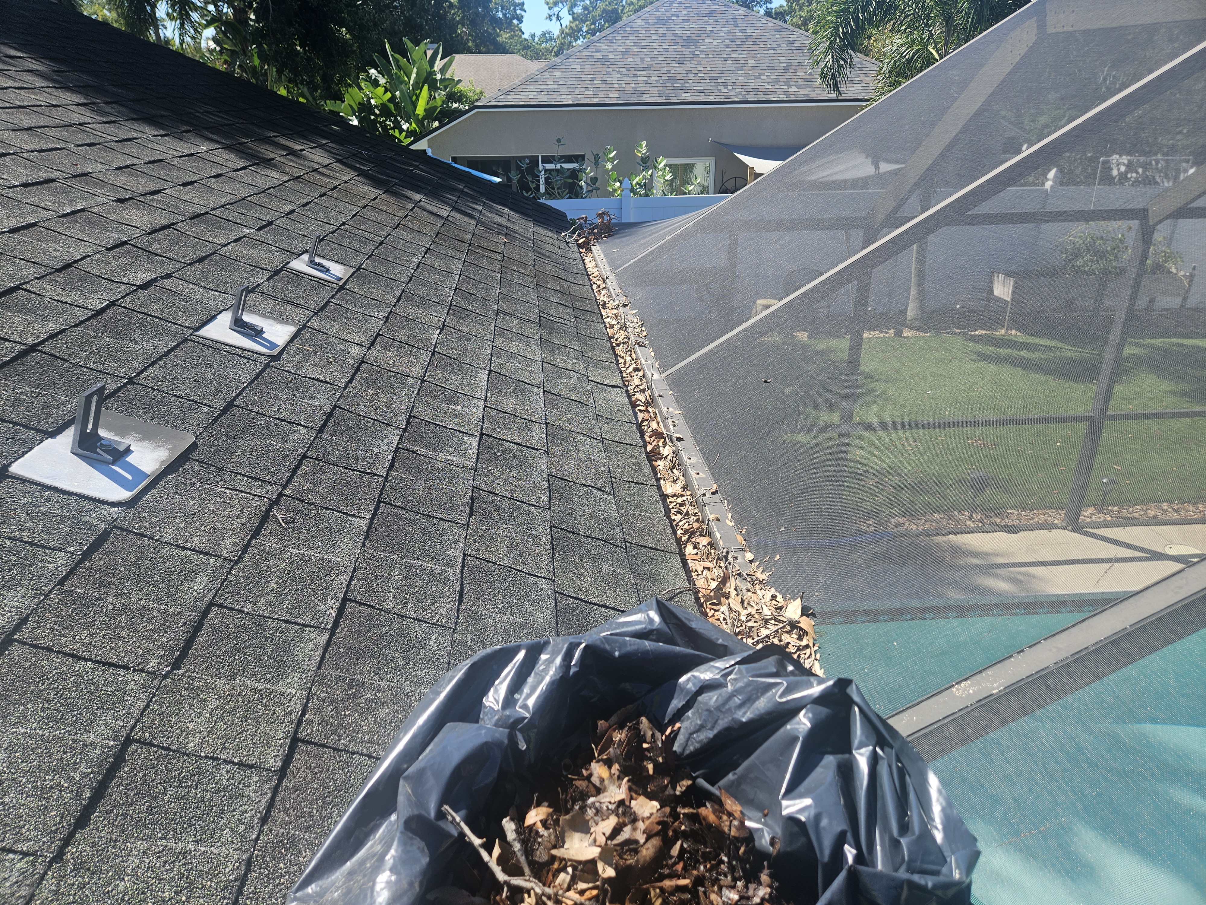 Gutters clogged with debris before cleaning