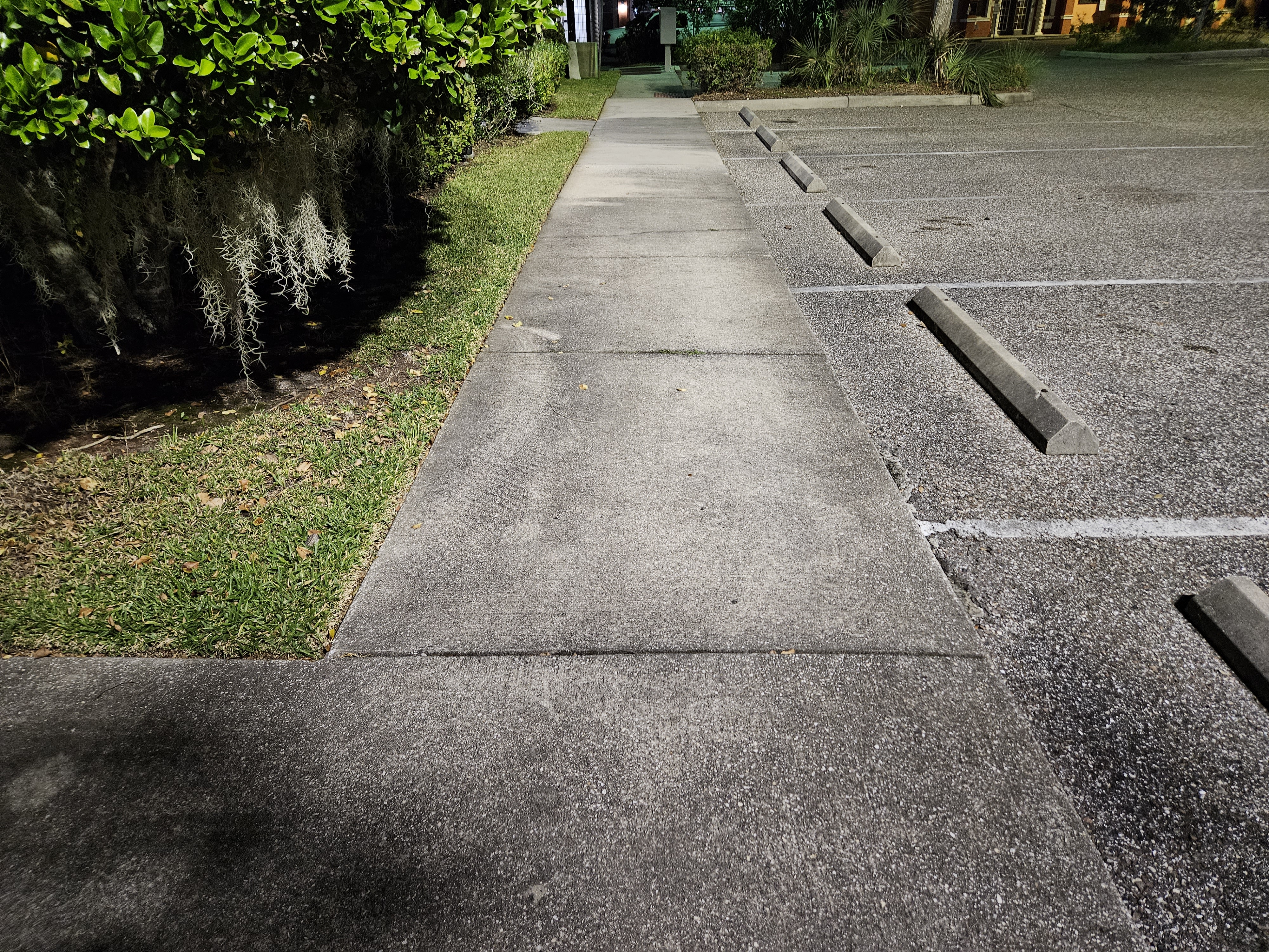 Dirty commercial sidewalk before pressure washing